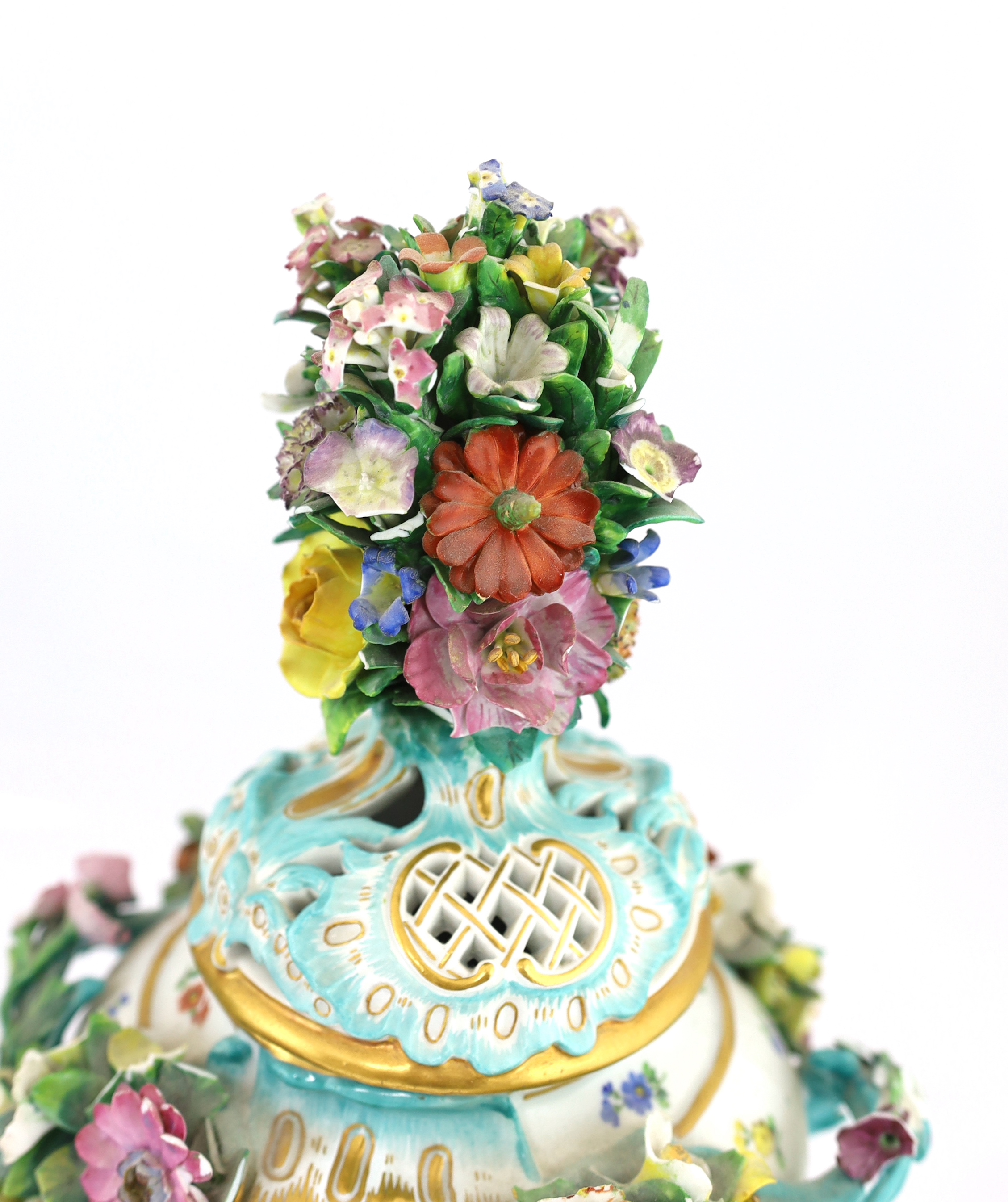 A pair of Meissen topographical flower encrusted vases and covers, 19th century, losses